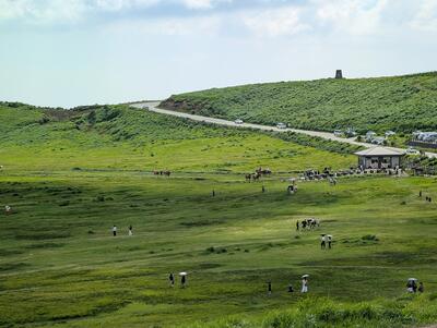 People riding horses in Kusasenrigahama